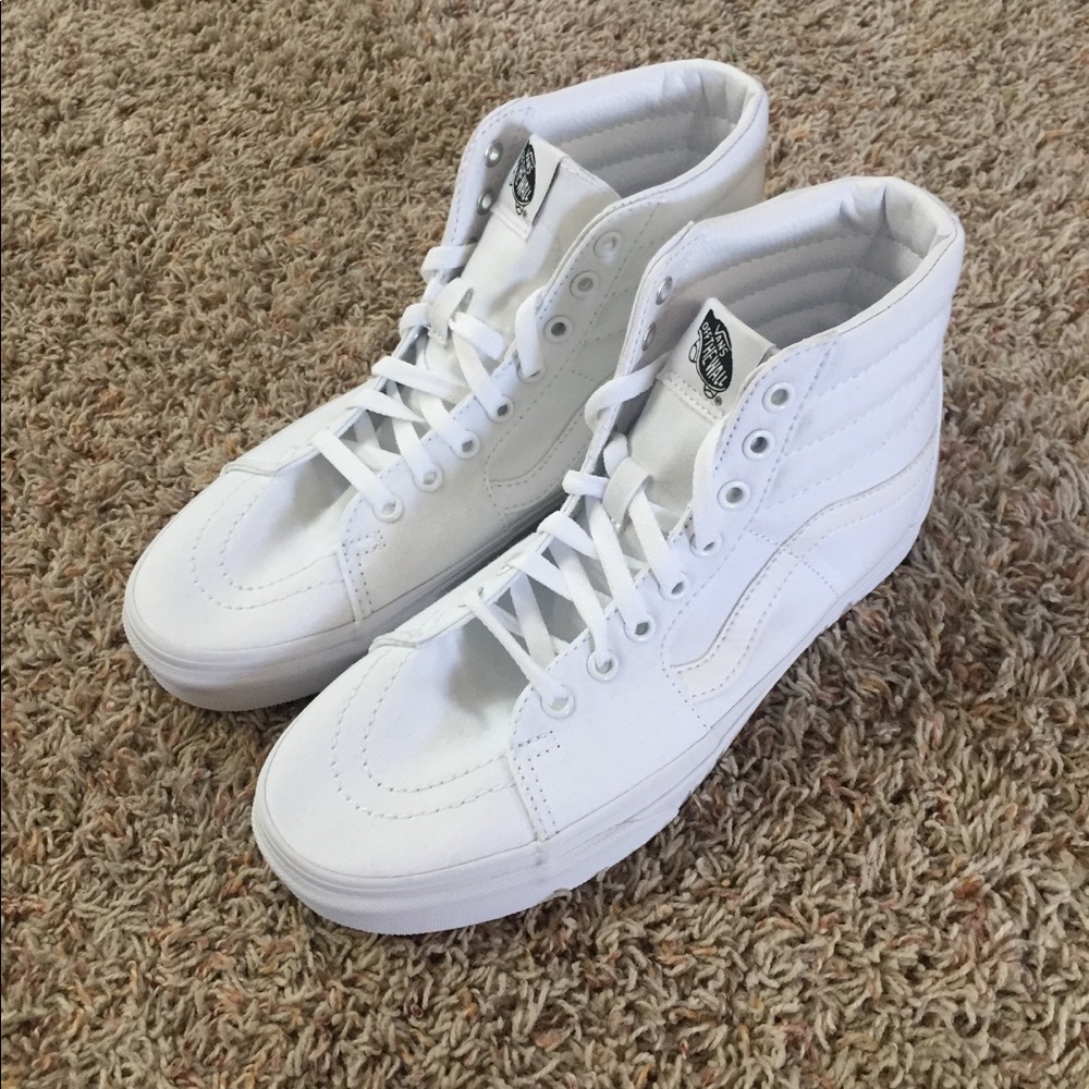 Brand new high top white vans.